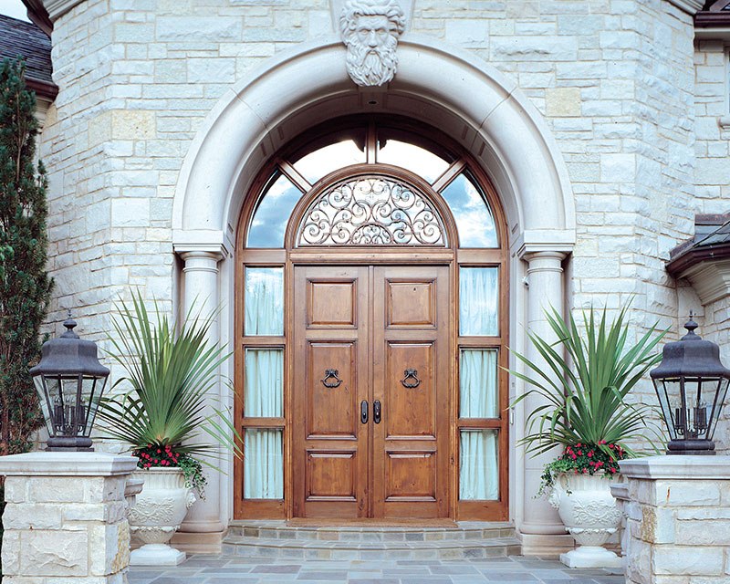 Set of double entry doors and millwork made of alder hardwood