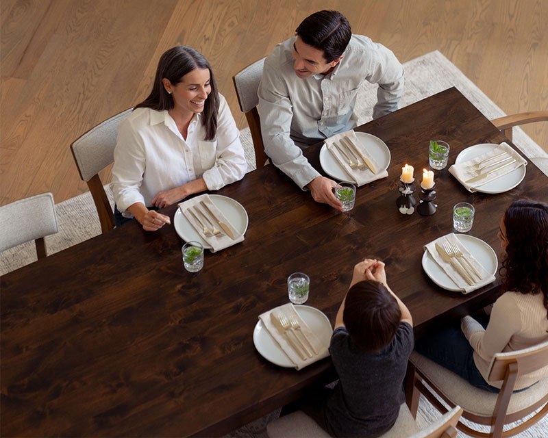 Alder Dining Table Furniture with family sitting enjoying a meal