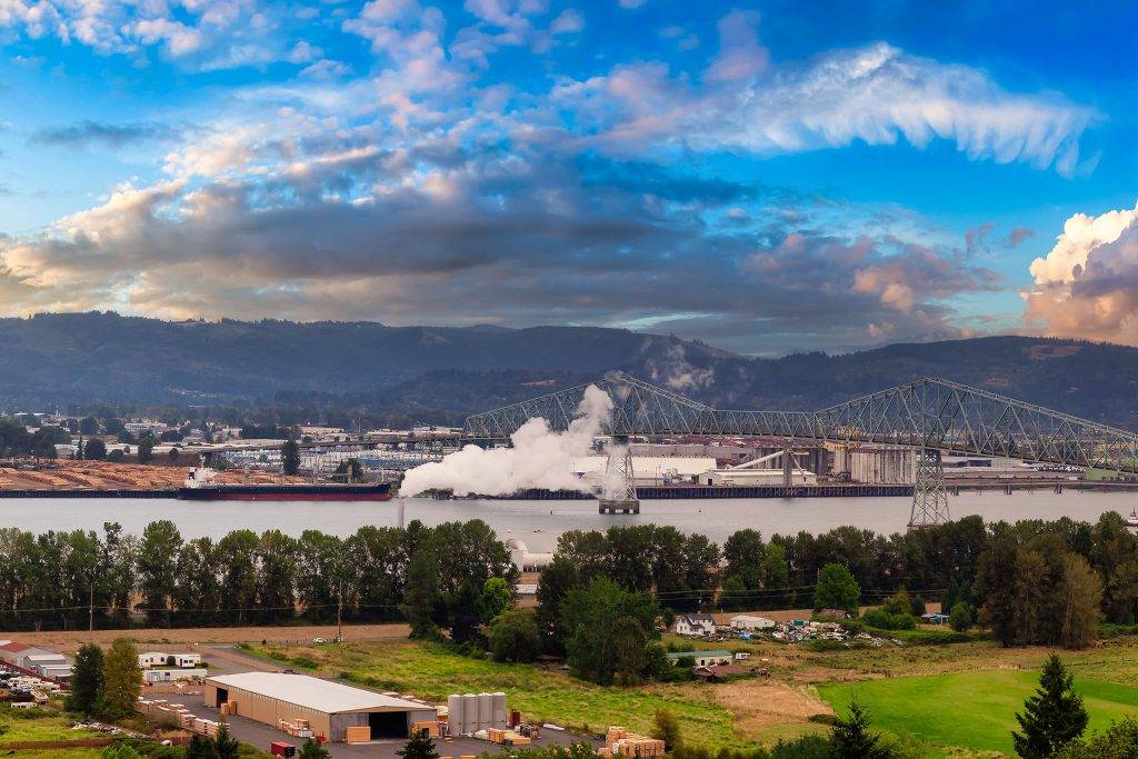 Longview, Washington. Aerial Panoramic View of Port, Industrial Sites and Lewis and Clark Bridge over Columbia River.