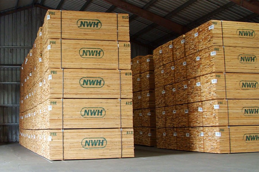 NWH Alder Hardwood Lumber stacked in a warehouse